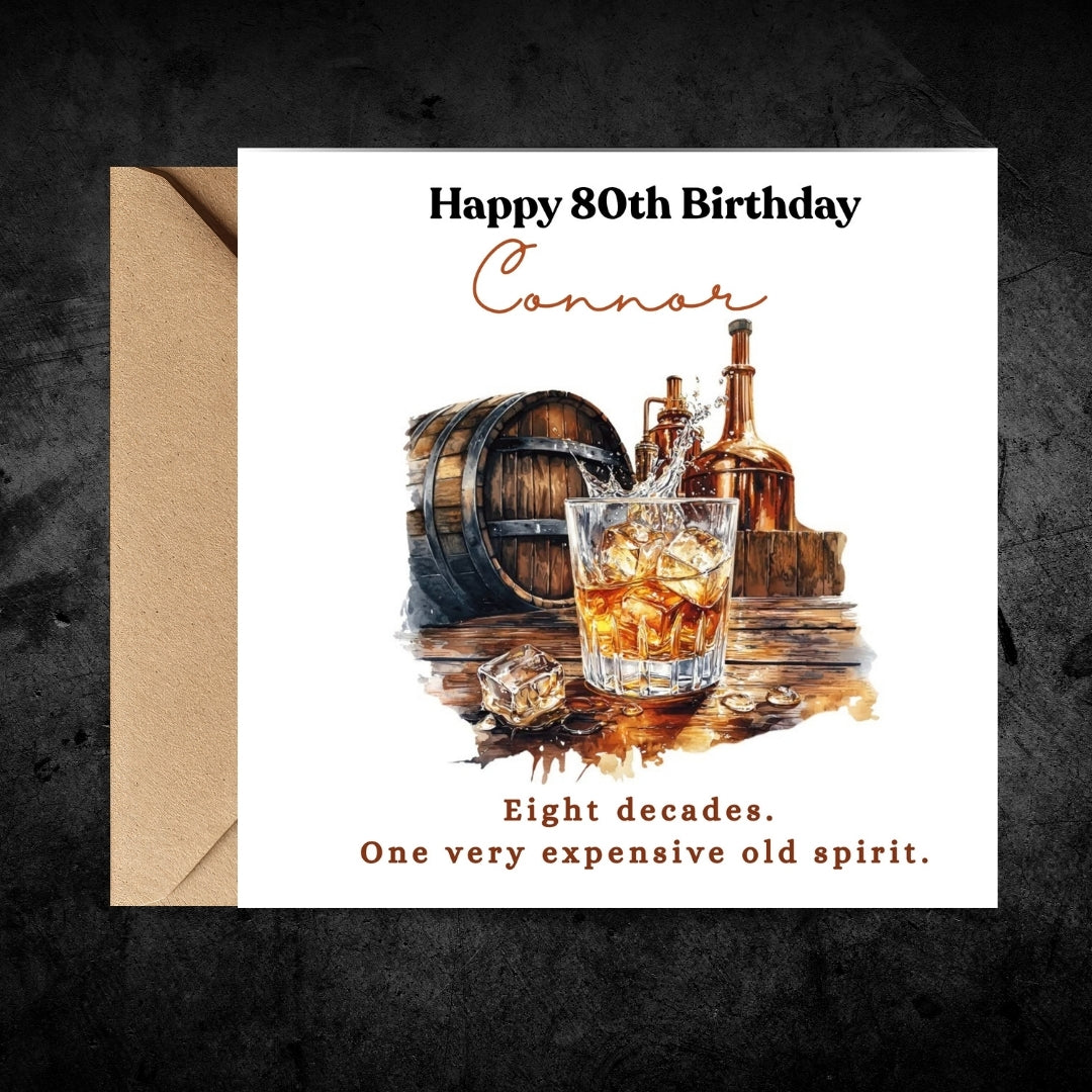 A personalized 80th birthday card with a kraft envelope, featuring a watercolor illustration of an old whiskey glass, barrel, and bottles. The card reads 'Happy 80th Birthday Connor' and 'Eight decades.