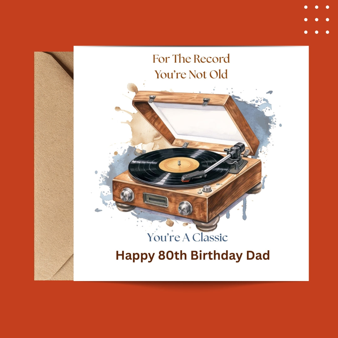 A square birthday card with a kraft envelope, featuring an illustration of a wooden turntable with a vinyl record. The card reads 'For The Record You're Not Old' at the top and 'You're A Classic Happy 80th Birthday Dad' at the bottom, set against a solid orange background.