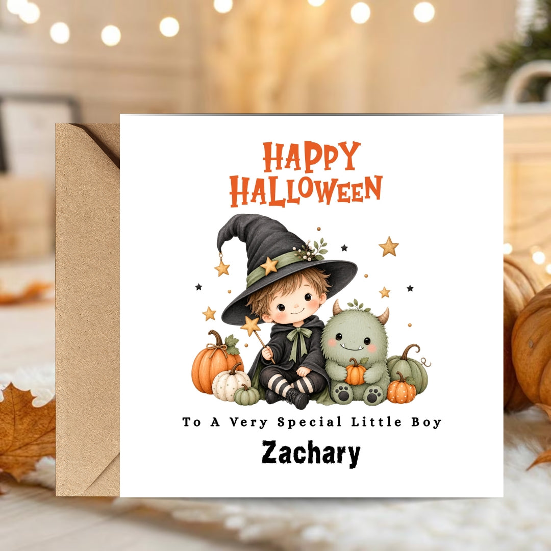 A personalized Halloween greeting card with a kraft envelope, featuring a cute cartoon boy in a witch hat and a green monster, with the text 'Happy Halloween To A Very Special Little Boy Zachary'.