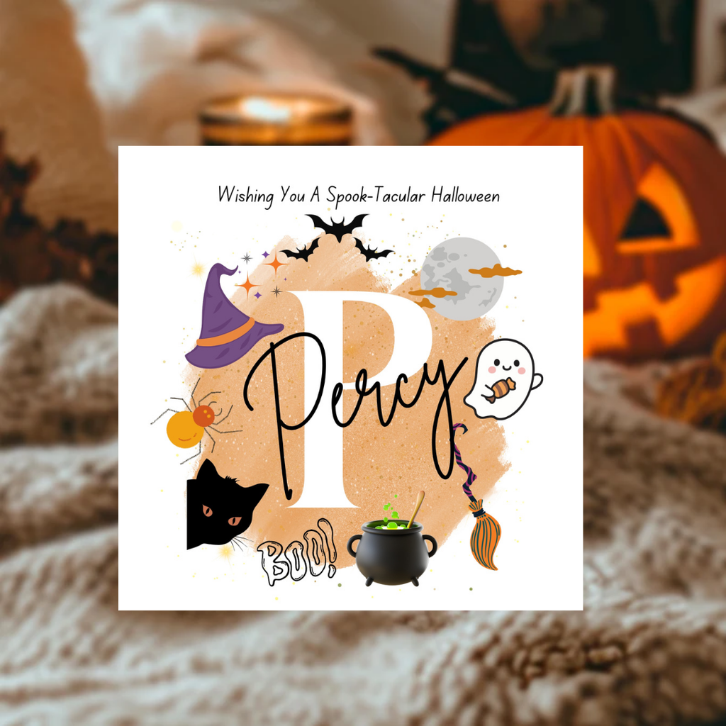 A square white Halloween greeting card or print featuring the word 'Percy' in large script, surrounded by spooky illustrations including a witch hat, spider, cat head, ghost, cauldron, broom, bats, and a moon. The top text reads 'Wishing You A Spooktacular Halloween.